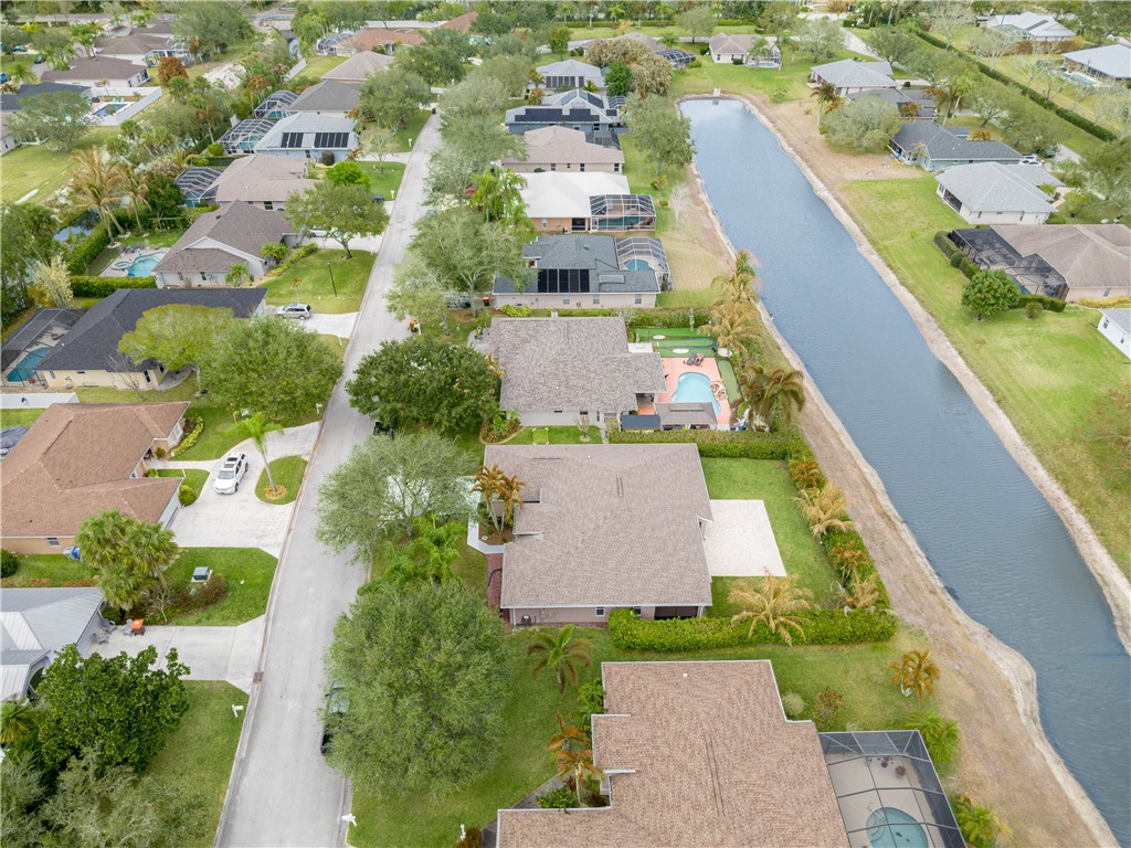 152 35th Square Southwest Vero Beach, FL 32968 - Photo 33 of 35 an aerial view of a house with a garden