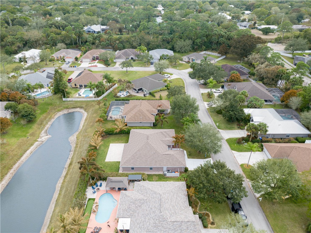 152 35th Square Southwest Vero Beach, FL 32968 - Photo 34 of 35 an aerial view of residential houses with outdoor space and lake view
