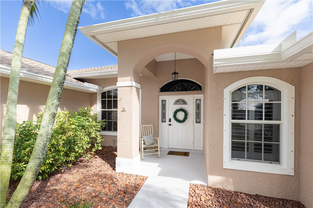 152 35th Square Southwest Vero Beach, FL 32968 - Photo 4 of 35 a view of front door and porch