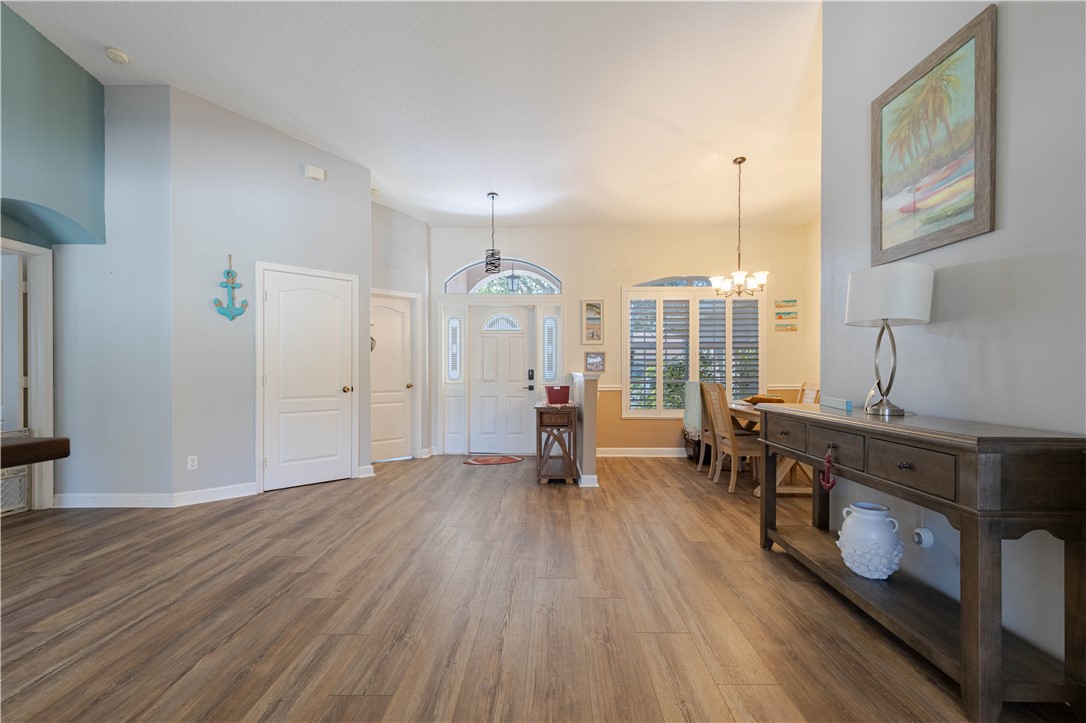 152 35th Square Southwest Vero Beach, FL 32968 - Photo 6 of 35 a view of a kitchen with furniture and wooden floor
