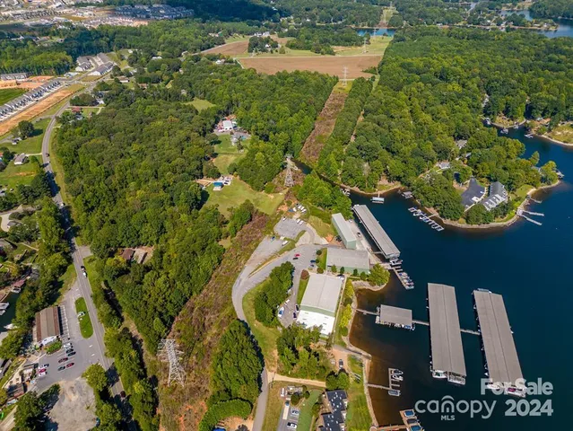 an aerial view of a house with a lake view