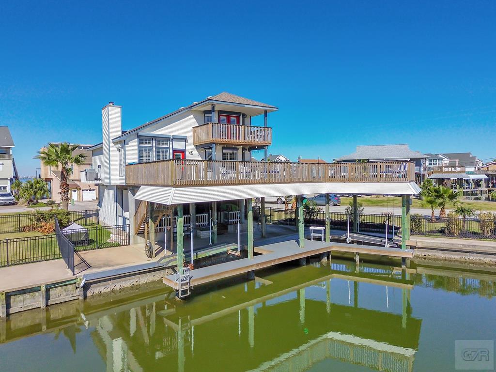 270 Isles End Road Tiki Island, TX 77554 - Photo 1 of 49 a view of a swimming pool with chairs