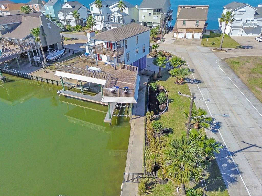 270 Isles End Road Tiki Island, TX 77554 - Photo 3 of 49 an aerial view of a house with a swimming pool