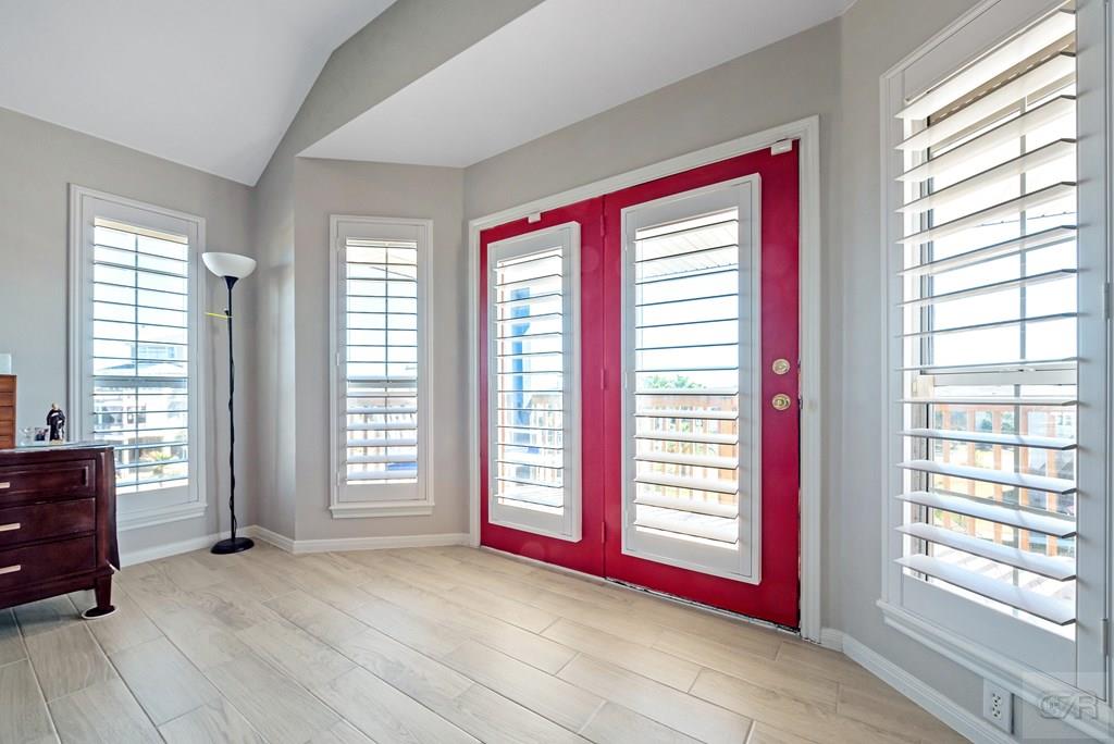 270 Isles End Road Tiki Island, TX 77554 - Photo 31 of 49 a view of an empty room with windows