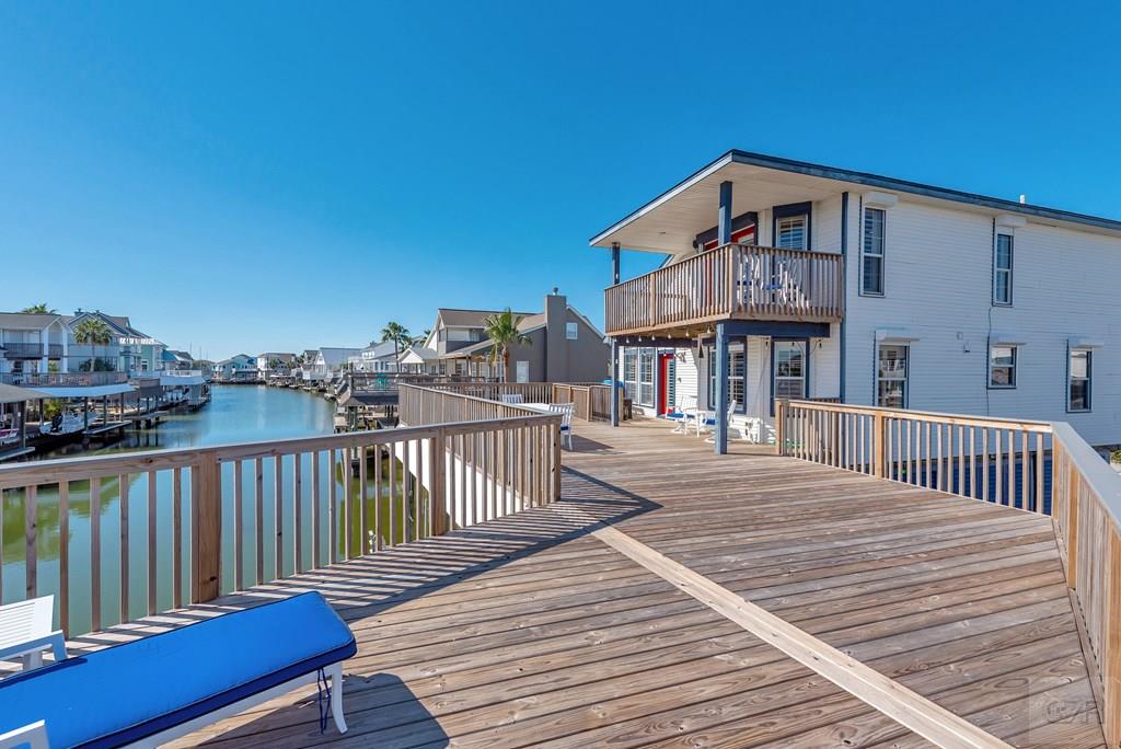 270 Isles End Road Tiki Island, TX 77554 - Photo 37 of 49 a front view of a house with wooden deck