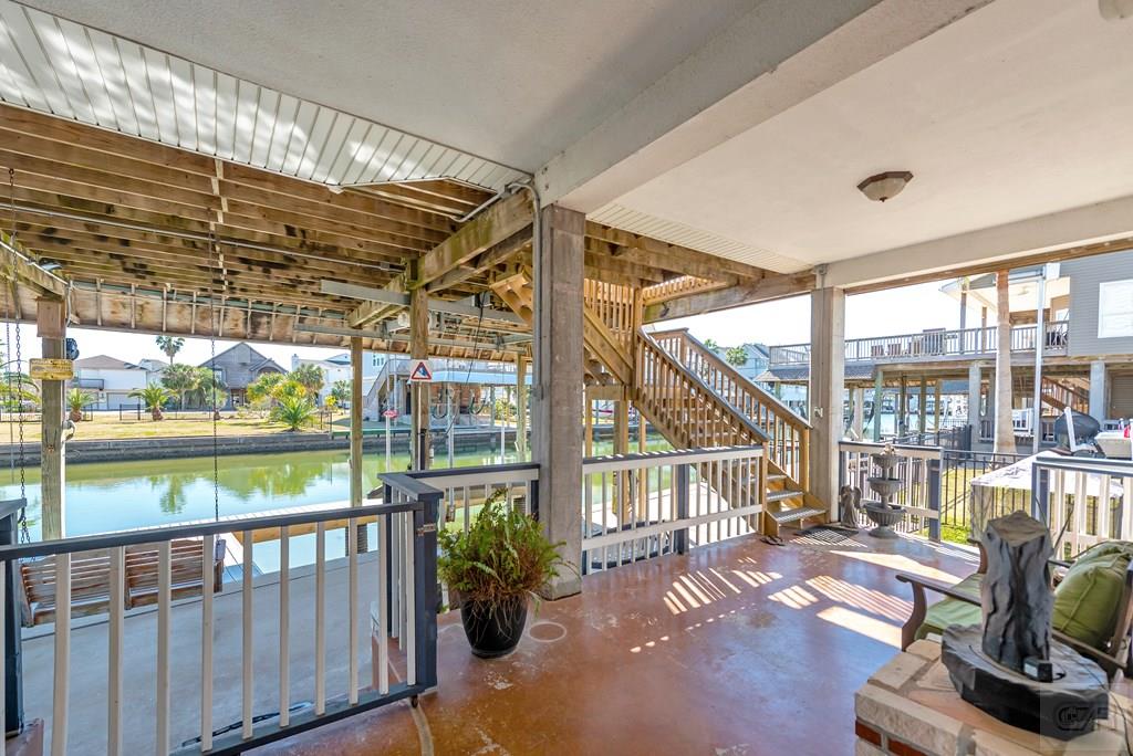 270 Isles End Road Tiki Island, TX 77554 - Photo 39 of 49 a view of a porch with furniture and floor to ceiling window