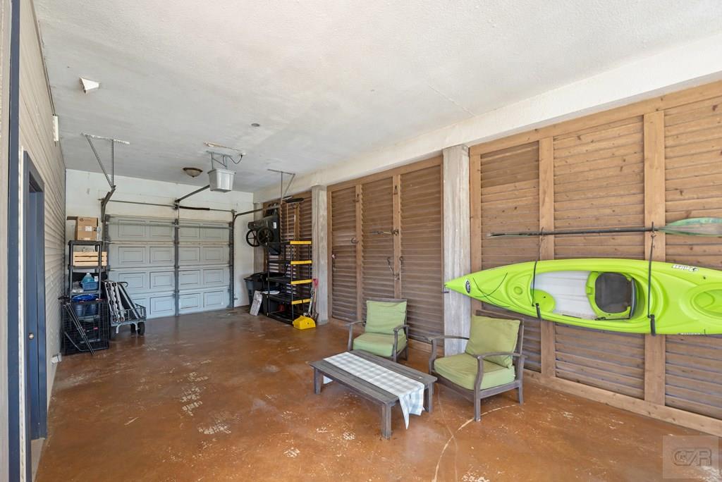 270 Isles End Road Tiki Island, TX 77554 - Photo 41 of 49 a view of a chairs and table in a patio
