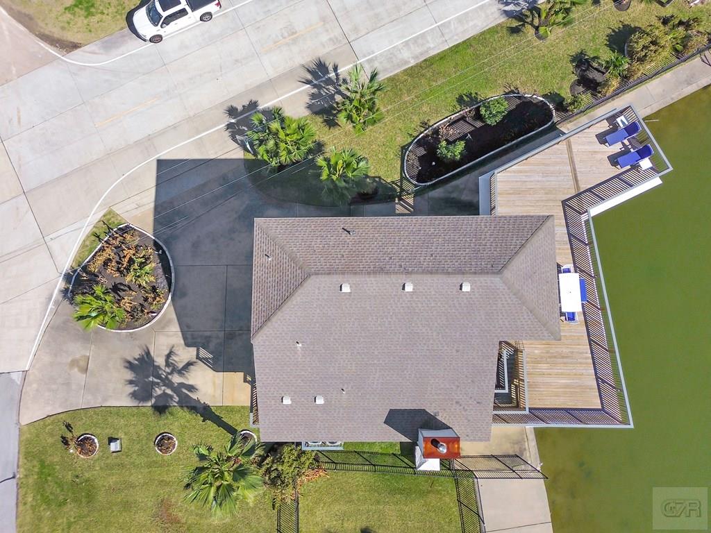 270 Isles End Road Tiki Island, TX 77554 - Photo 49 of 49 an aerial view of a house with a swimming pool