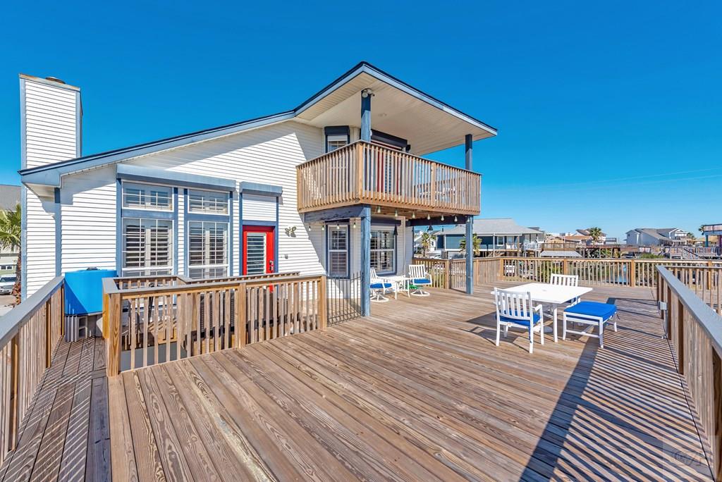 270 Isles End Road Tiki Island, TX 77554 - Photo 5 of 49 a front view of a house with a deck