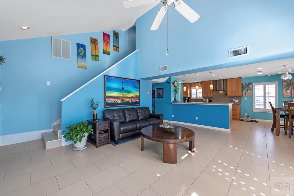 270 Isles End Road Tiki Island, TX 77554 - Photo 10 of 49 a living room with furniture and a flat screen tv