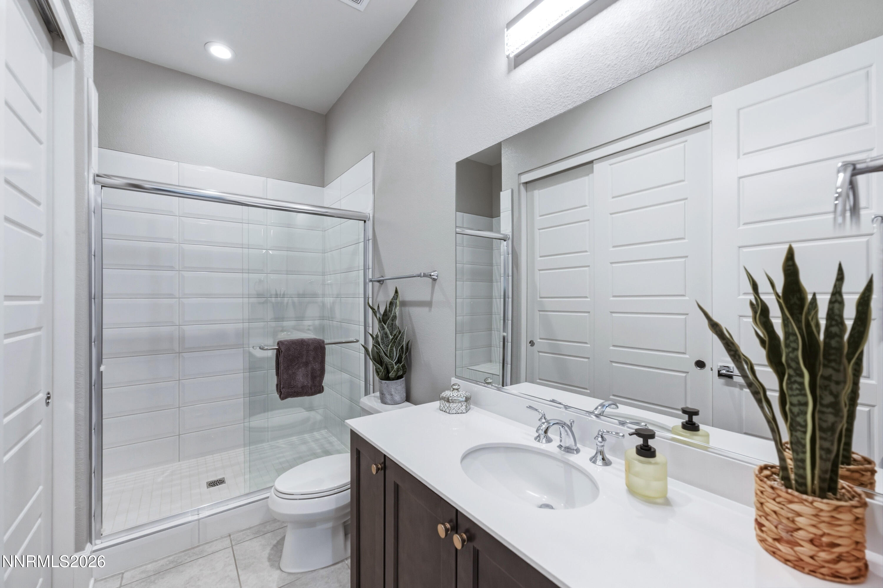 9028 Iron Sky Court Reno, NV 89523 - Photo 17 of 36 a bathroom with a sink a toilet and shower