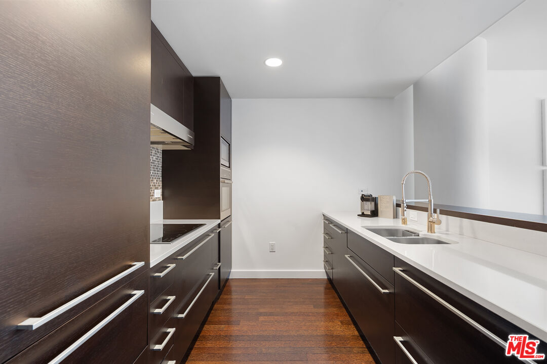 6250 Hollywood Boulevard, Unit 7K Los Angeles, CA 90028 - Photo 13 of 50 a room with a sink and cabinets
