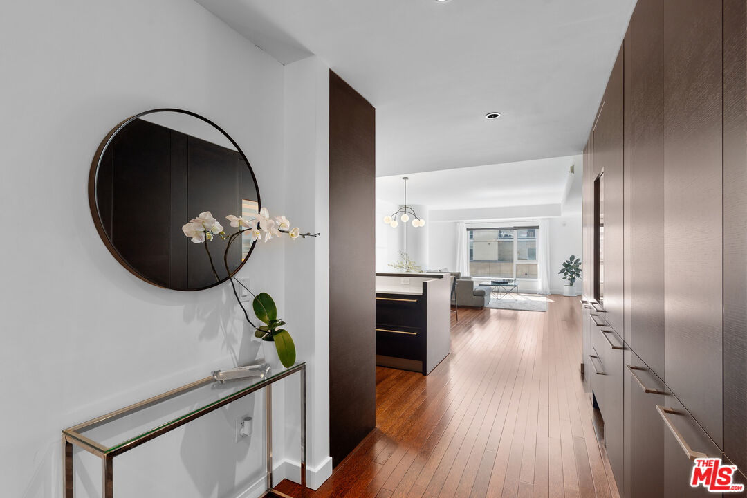 6250 Hollywood Boulevard, Unit 7K Los Angeles, CA 90028 - Photo 17 of 50 a view of living room and kitchen with wooden floor