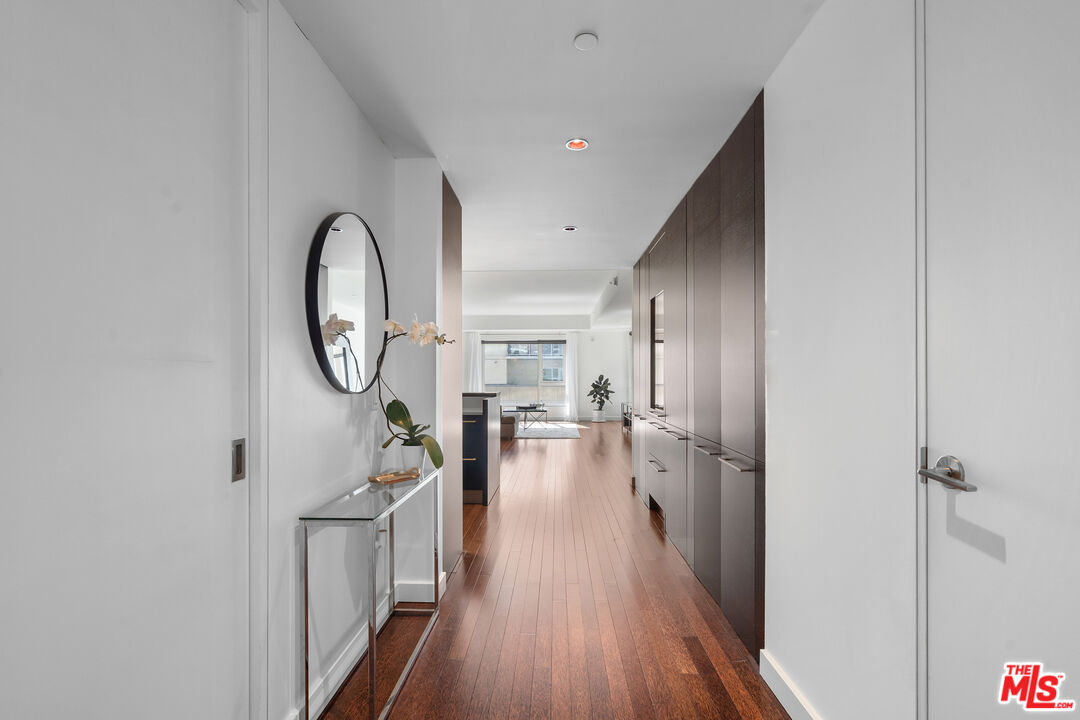 6250 Hollywood Boulevard, Unit 7K Los Angeles, CA 90028 - Photo 27 of 50 a view of a hallway to a livingroom and furniture