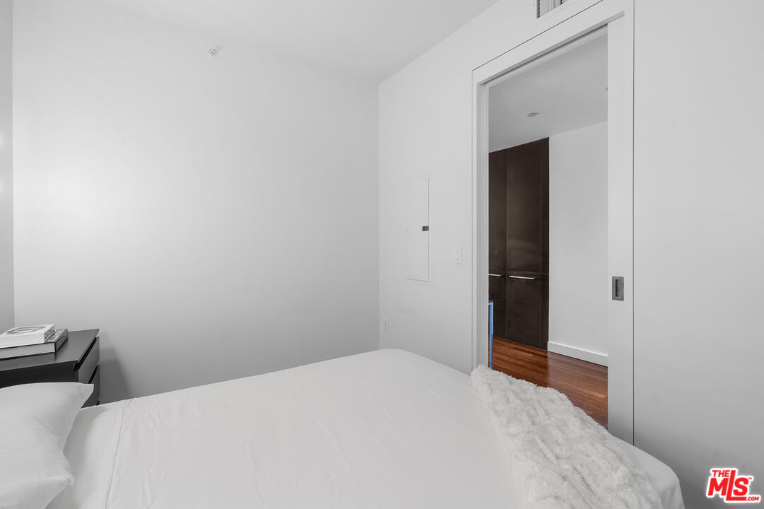 6250 Hollywood Boulevard, Unit 7K Los Angeles, CA 90028 - Photo 30 of 50 a bedroom with a bed and hallway