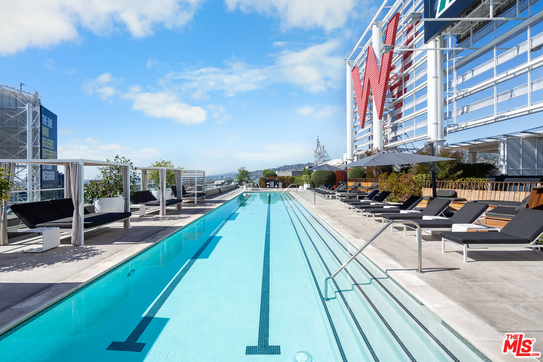 6250 Hollywood Boulevard, Unit 7K Los Angeles, CA 90028 - Photo 35 of 50 a view of swimming pool with outdoor seating and buildings in the background