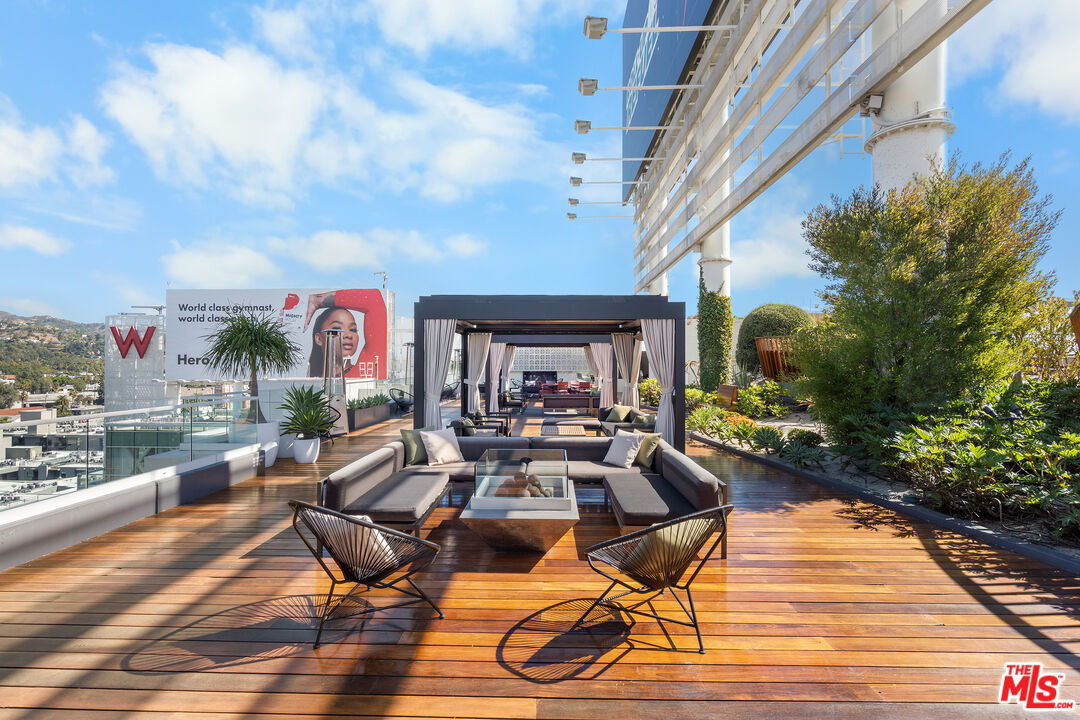6250 Hollywood Boulevard, Unit 7K Los Angeles, CA 90028 - Photo 39 of 50 a view of a patio with couches table and chairs and potted plants
