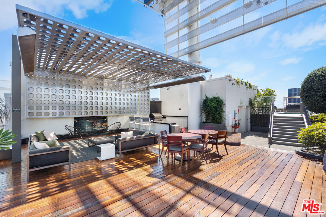 6250 Hollywood Boulevard, Unit 7K Los Angeles, CA 90028 - Photo 41 of 50 a living room with furniture a fireplace and wooden floor