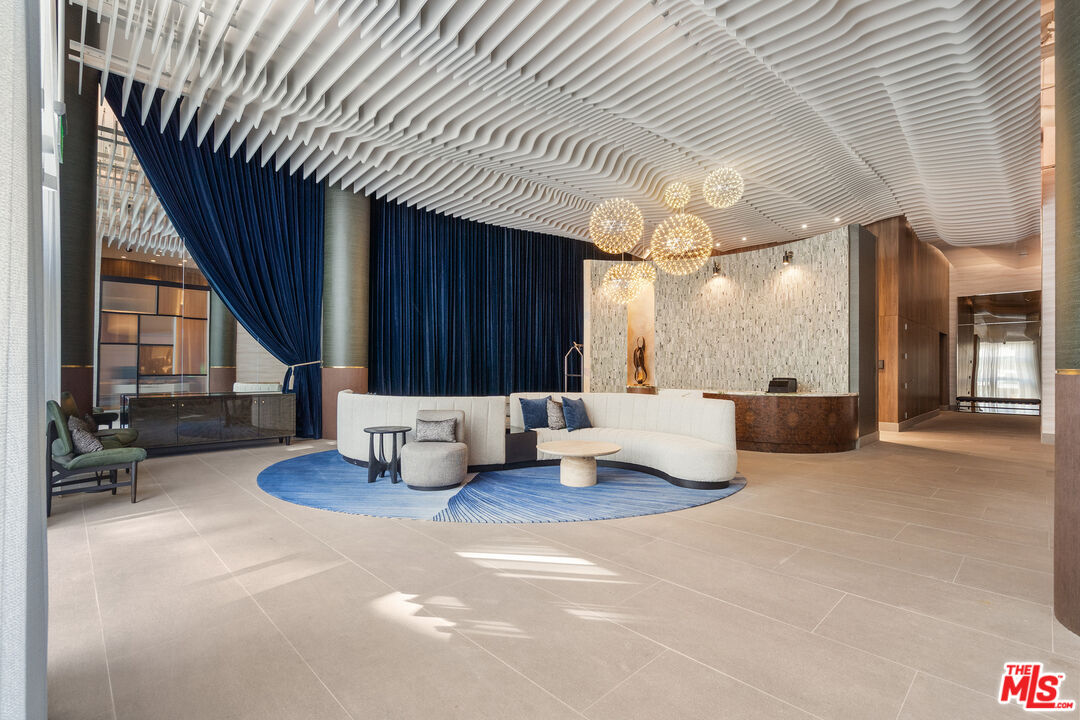 6250 Hollywood Boulevard, Unit 7K Los Angeles, CA 90028 - Photo 46 of 50 a living room with furniture and a large window