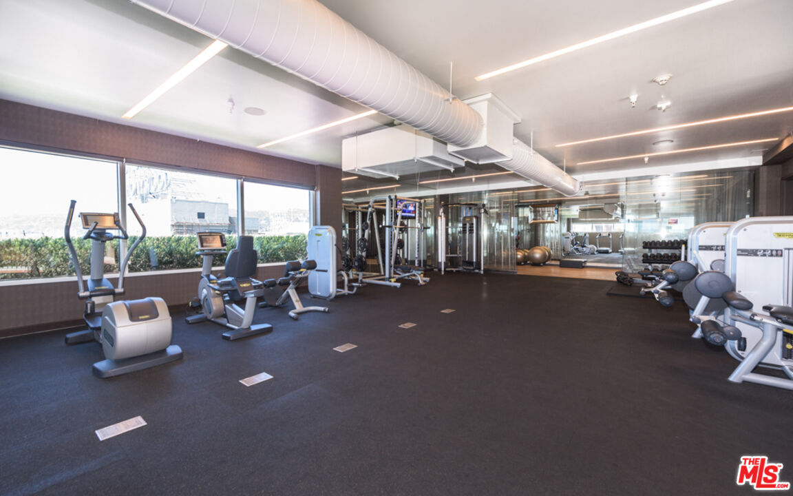 6250 Hollywood Boulevard, Unit 7K Los Angeles, CA 90028 - Photo 48 of 50 a living room with lots of furniture and a large window