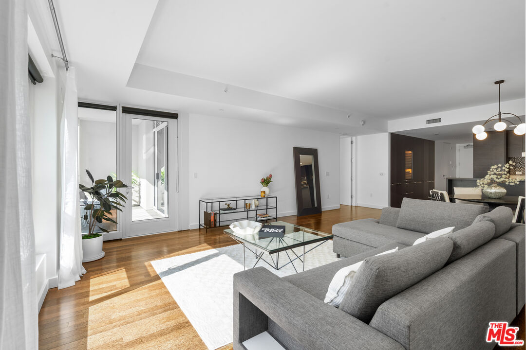 6250 Hollywood Boulevard, Unit 7K Los Angeles, CA 90028 - Photo 7 of 50 a living room with furniture and a table