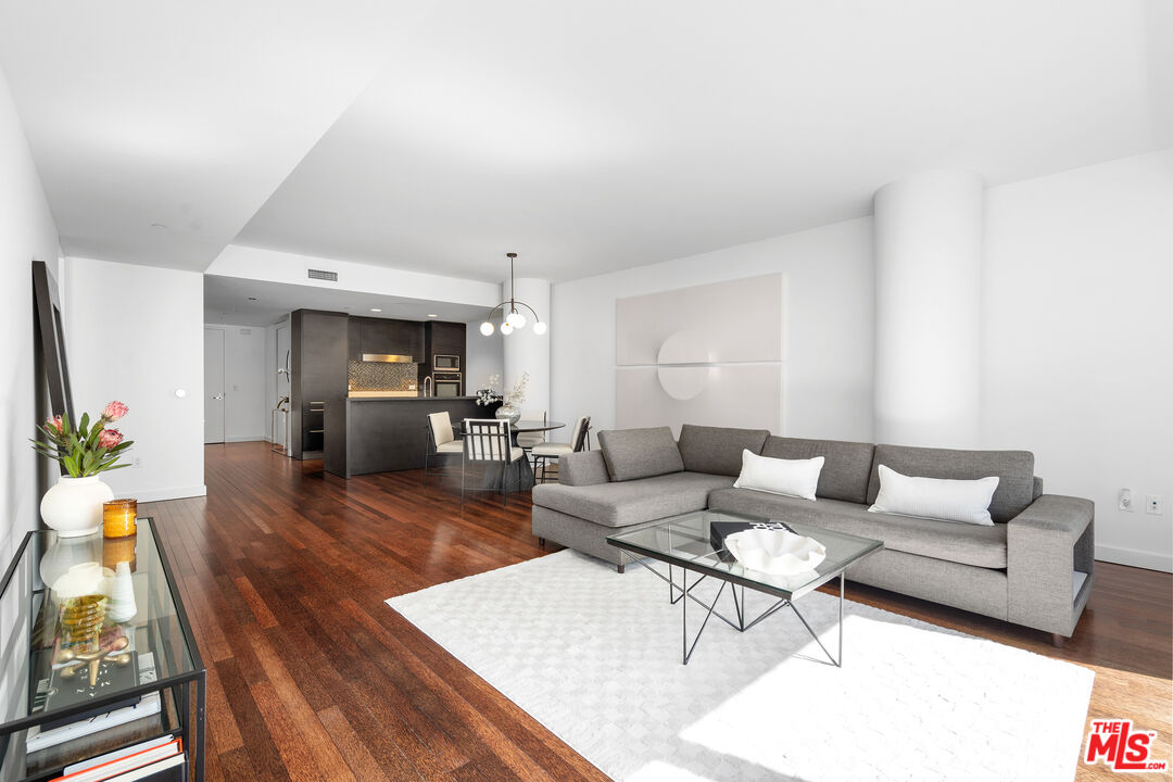 6250 Hollywood Boulevard, Unit 7K Los Angeles, CA 90028 - Photo 8 of 50 a living room with furniture wooden floor and a table