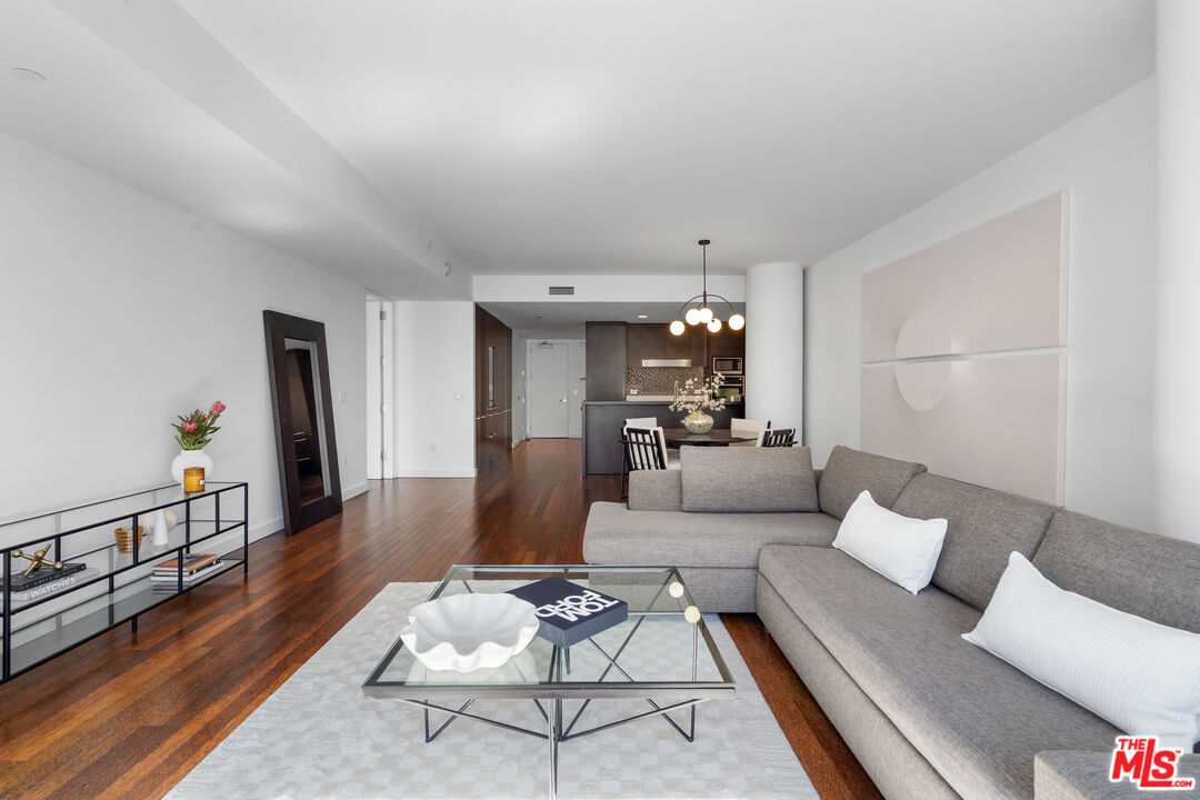 6250 Hollywood Boulevard, Unit 7K Los Angeles, CA 90028 - Photo 9 of 50 a living room with furniture and a wooden floor