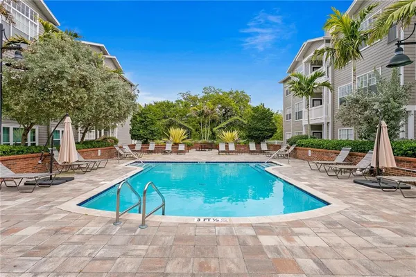 a view of a swimming pool with a lounge chairs
