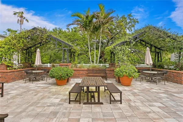 a view of a backyard with sitting area
