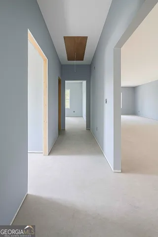 a view of a big room with closet and windows