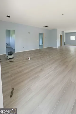 a view of an empty room and window