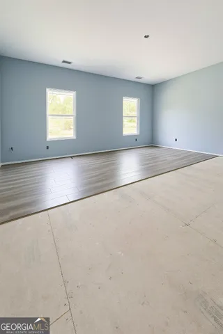 an empty room with windows