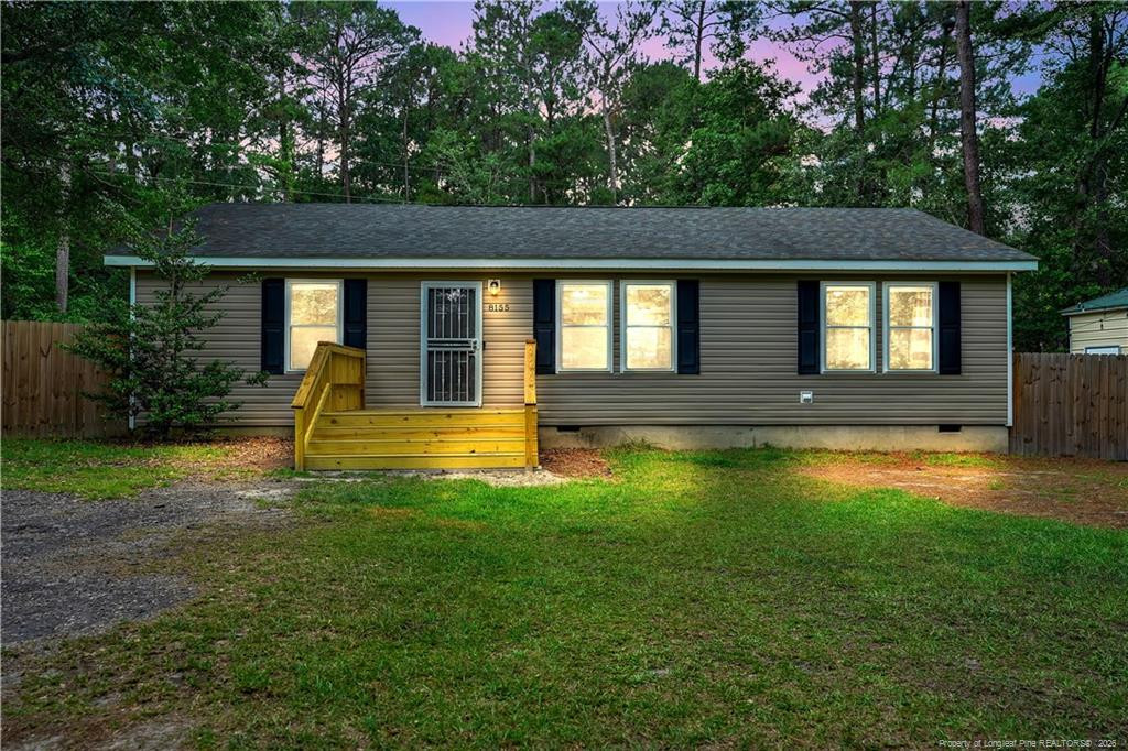 8155 Arabia Road Lumber Bridge, NC 28357 - Photo 2 of 30 a front view of a house with a yard
