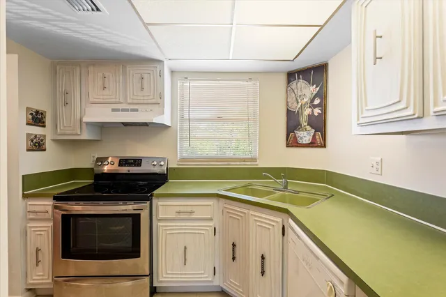 a kitchen with a stove and a sink