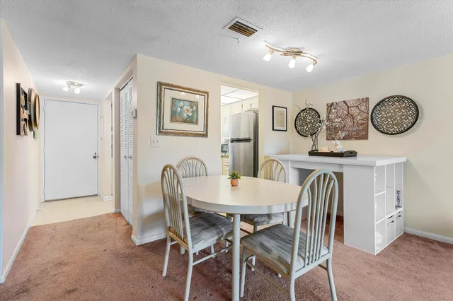 a view of a dining room with furniture