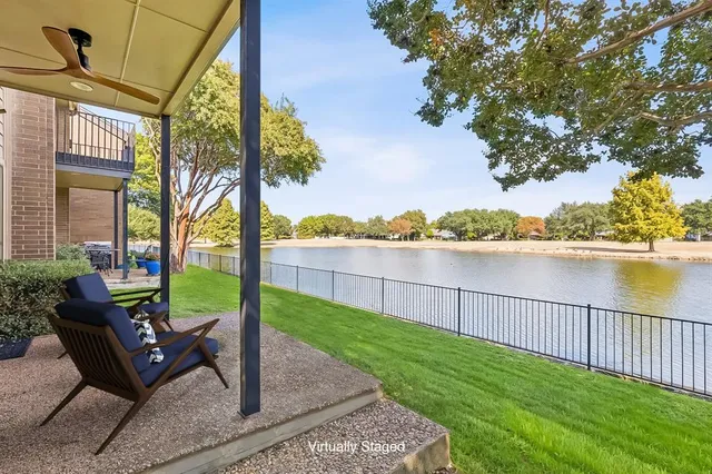a view of a garden with a bench in the patio