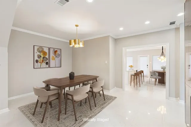 a view of a dining room with furniture