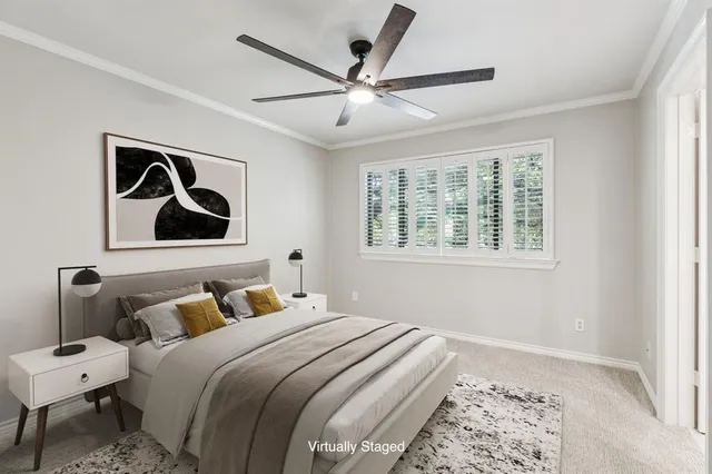 a bedroom with a large bed and a window