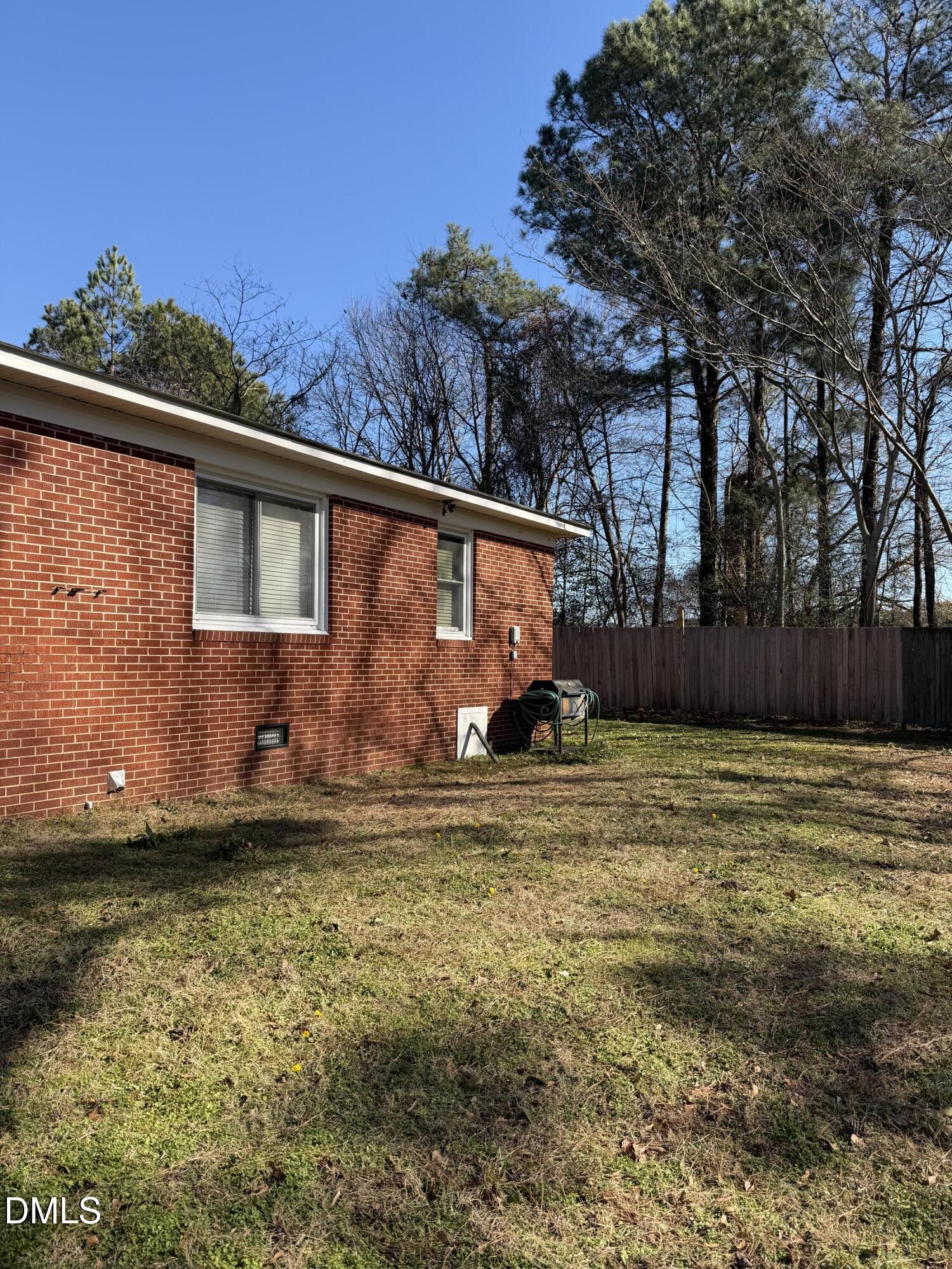 404 Forbes Drive Smithfield, NC 27577 - Photo 11 of 11 a backyard of a house with lots of green space