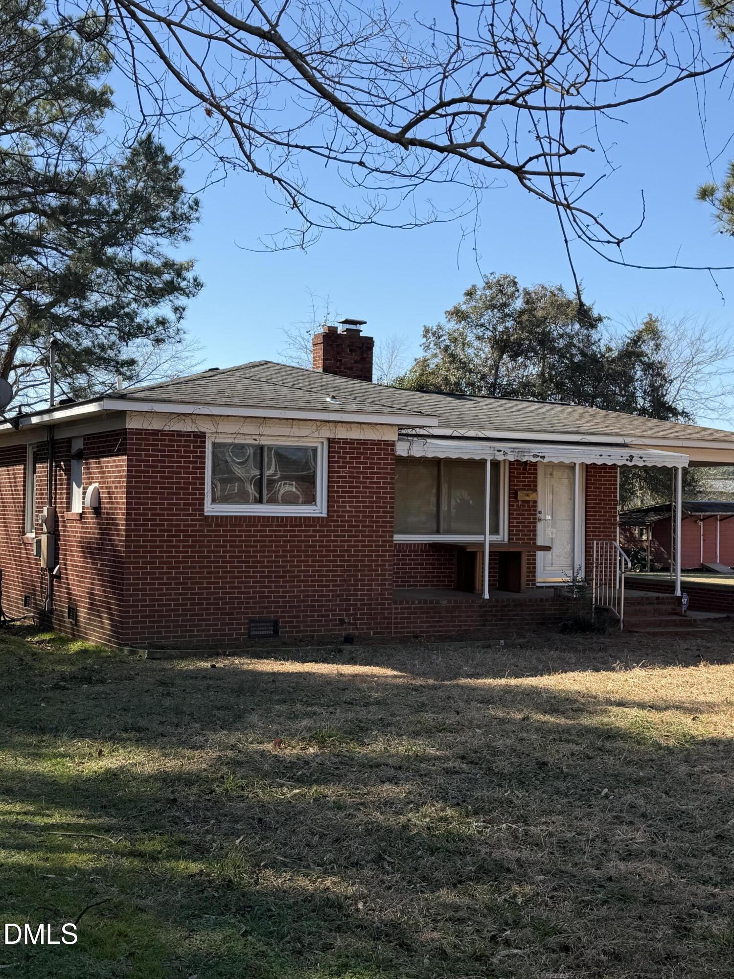 404 Forbes Drive Smithfield, NC 27577 - Photo 2 of 11 a view of a yard in front of a house with large tree