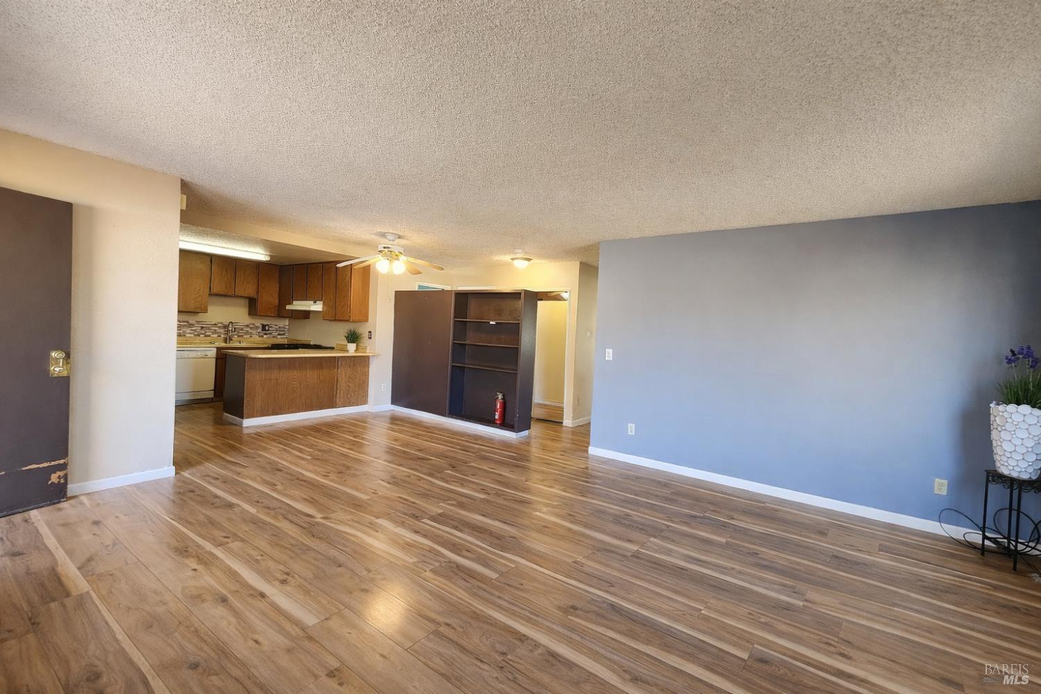 717 Blair Place Santa Rosa, CA 95401 - Photo 4 of 23 a view of a kitchen with a sink and a refrigerator