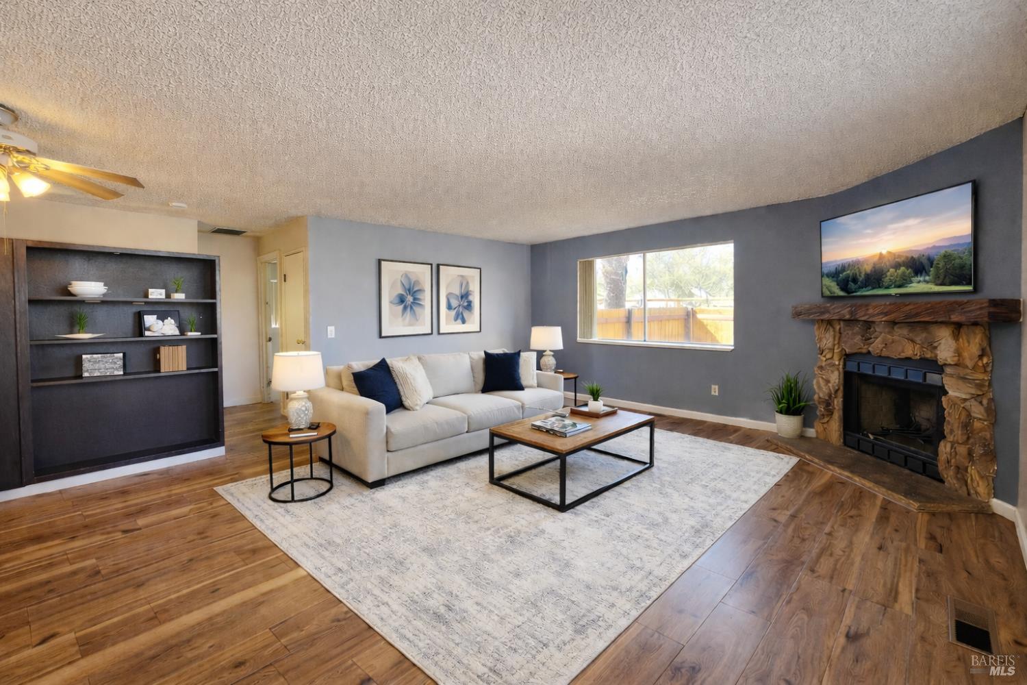 717 Blair Place Santa Rosa, CA 95401 - Photo 5 of 23 a living room with furniture and a fireplace