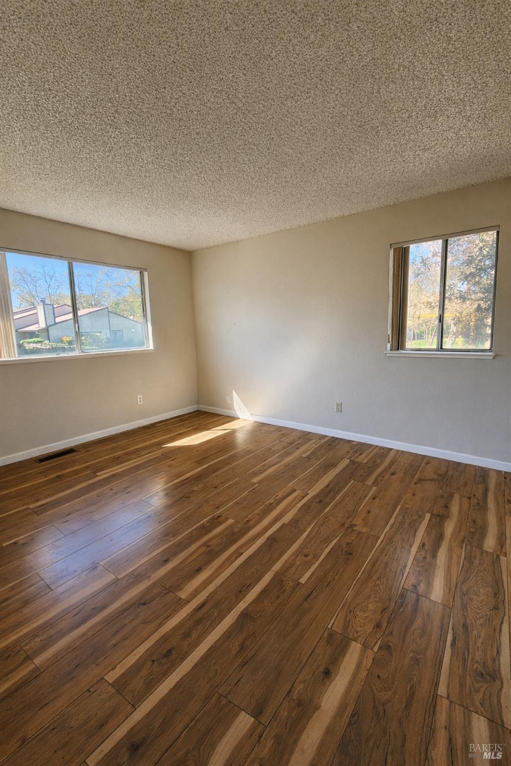 717 Blair Place Santa Rosa, CA 95401 - Photo 10 of 23 a view of a room with wooden floor and window