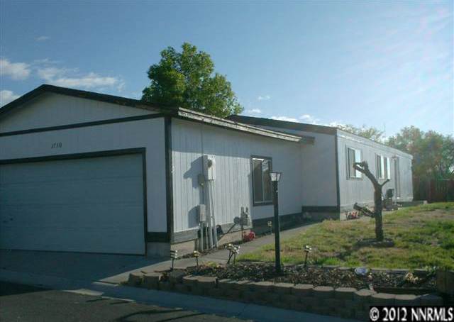 2730 Snapdragon Way Reno, NV 89512 - Photo 1 of 1 a front view of a house with garden