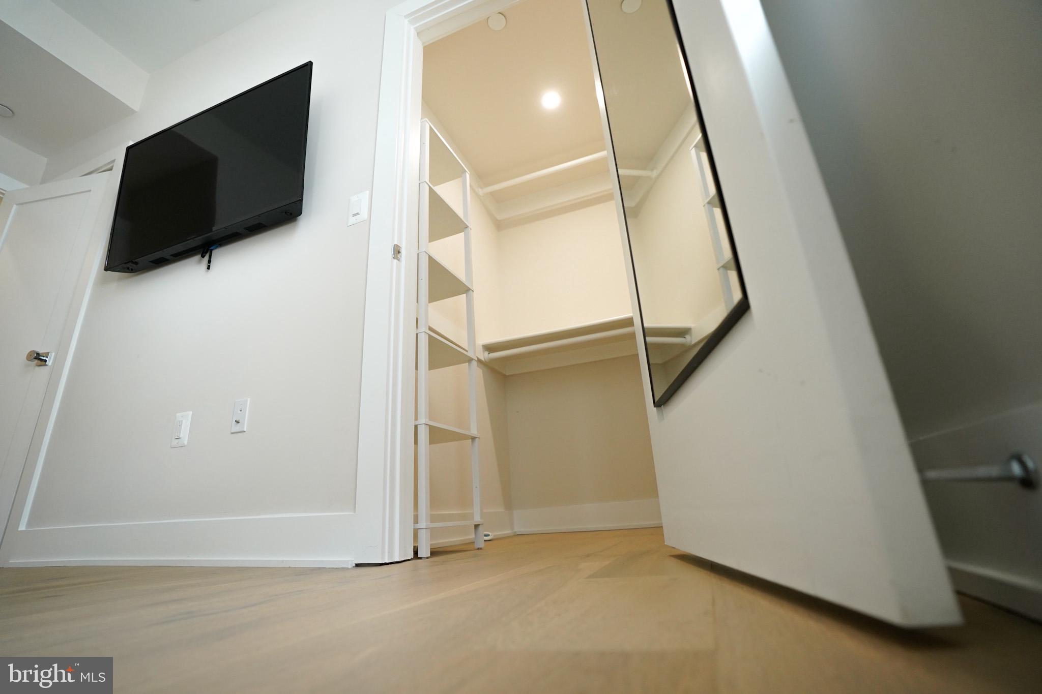 1421 Spring Road Northwest Washington, DC 20010 - Photo 11 of 12 Sleek closet with modern design.