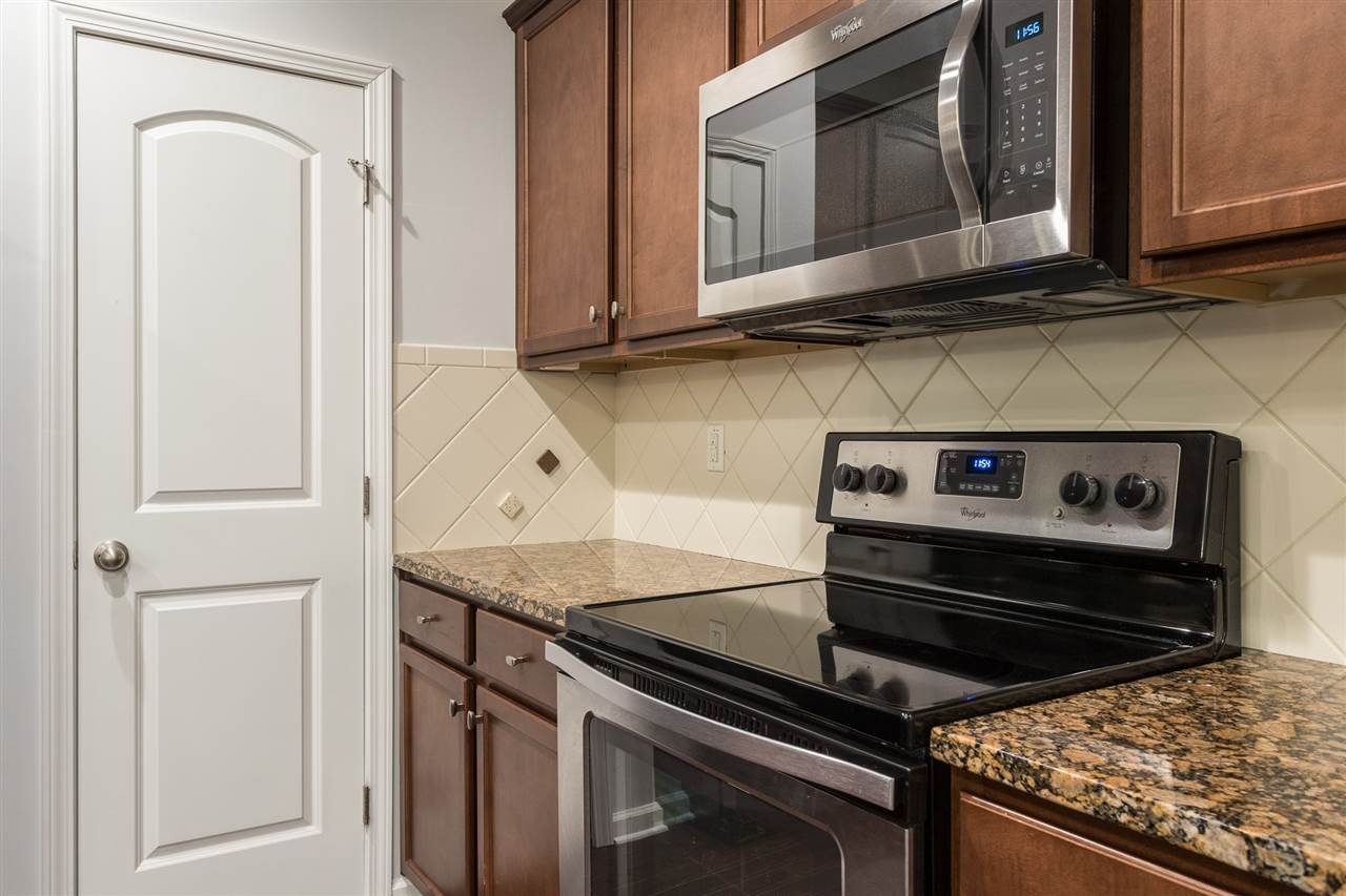 9929 Lynnberry Place Raleigh, NC 27617 - Photo 13 of 30 The kitchen in this home provides a full appliance package which includes a smooth top electric range with a self cleaning oven, a built-in microwave, dishwasher and a refrigerator. A spacious walk-in pantry is provided for additional storage. Kitchen
