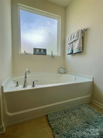 a bathroom with a bathtub and a sink