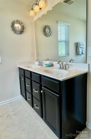 a bathroom with a sink a mirror and a bathtub