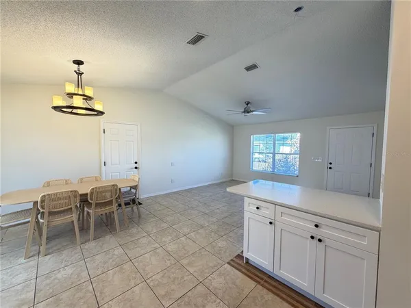 a view of a kitchen area with a sink furniture and wooden floor