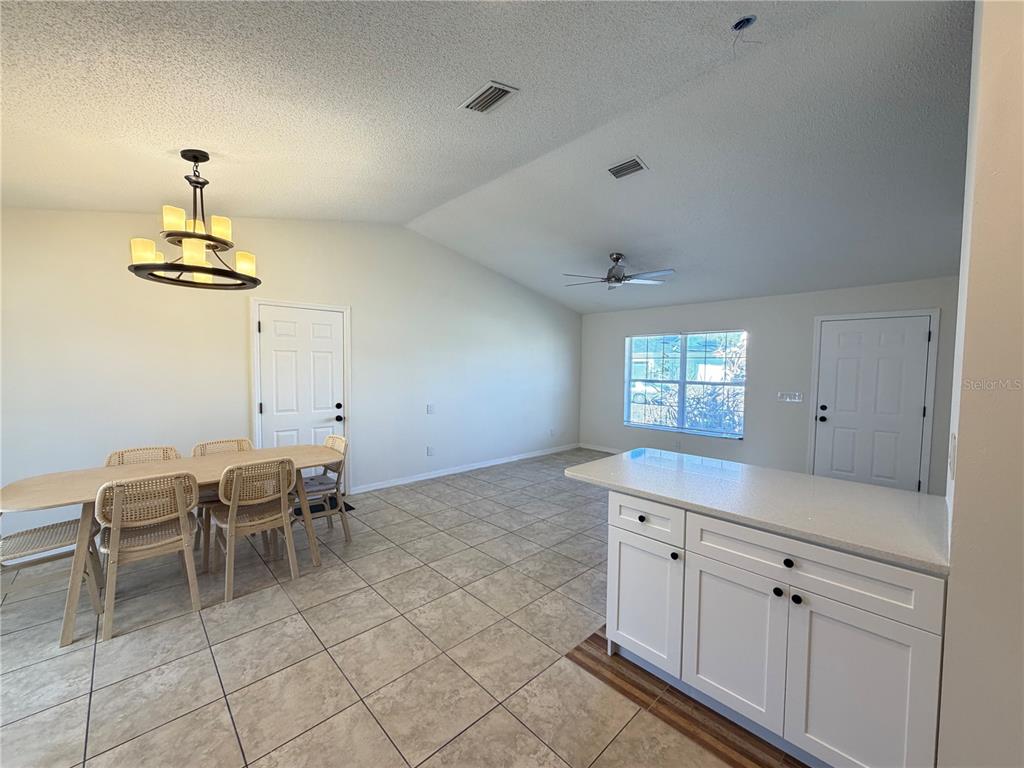 16 Powder Hill Lane Palm Coast, FL 32164 - Photo 14 of 27 a view of a kitchen area with a sink furniture and wooden floor